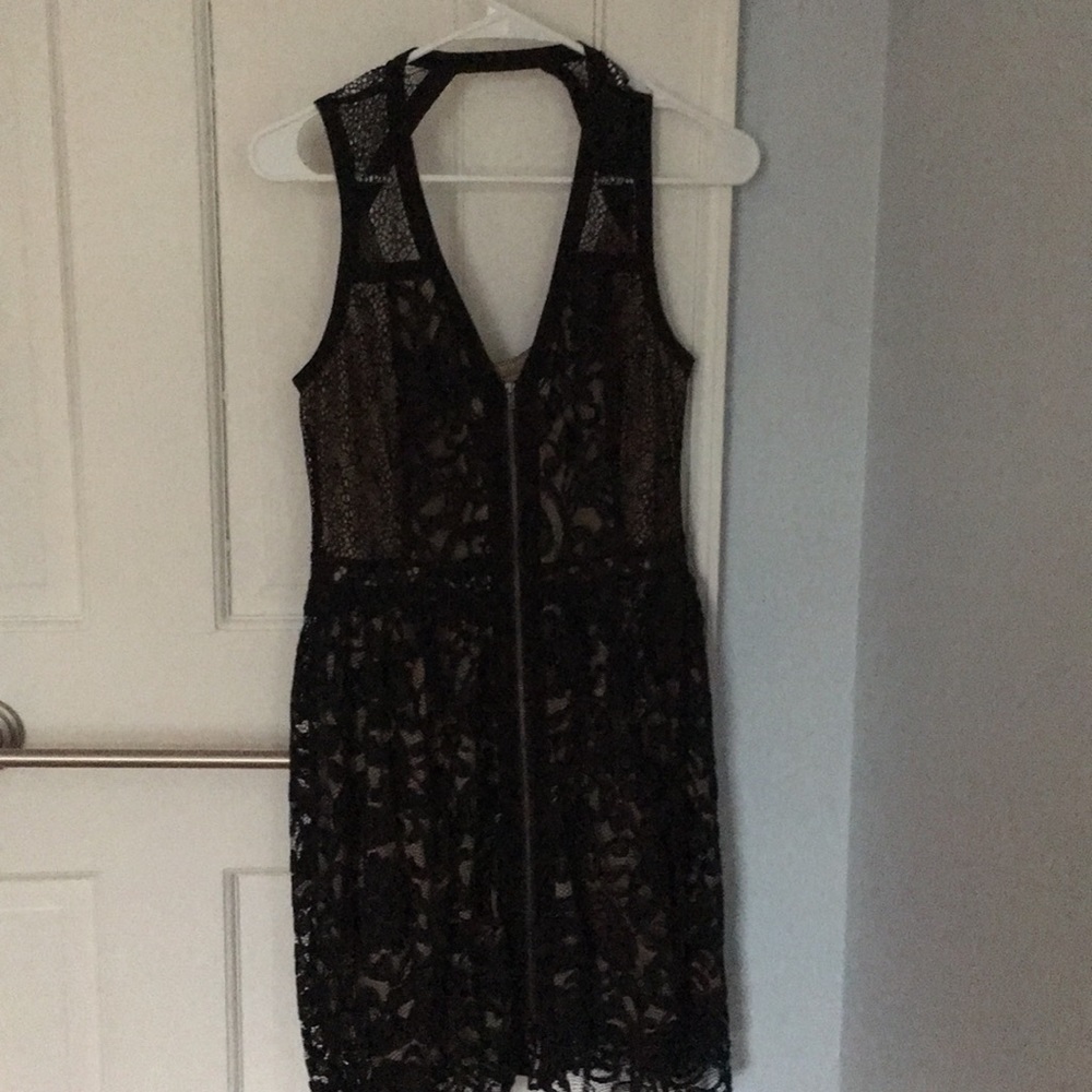 Lace cocktail dress. Zip front, nude underlay.